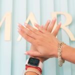 A Person's Hands with Art Nails and wearing smartwatch