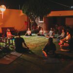 Photo of People Meditating Together