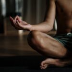 Man in Black Shorts Sitting on Floor