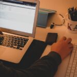 Man Hands around Laptop