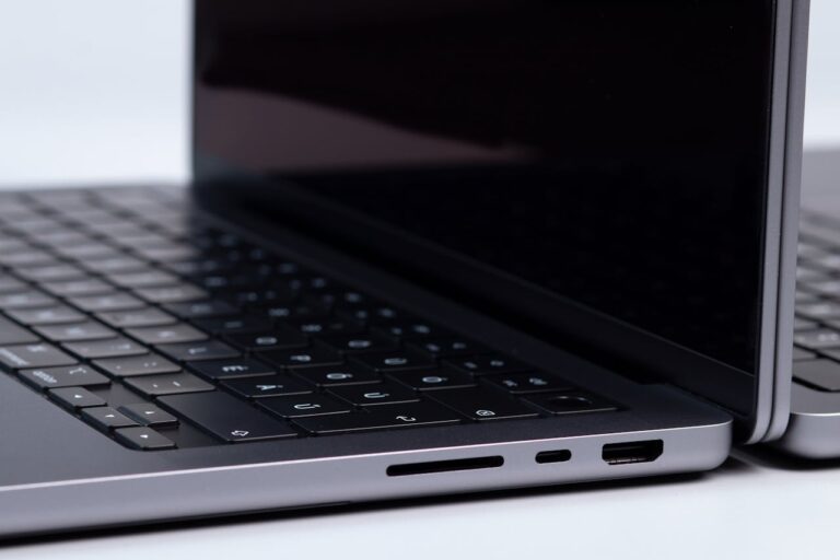 Close-up Shot of a Apple MacBook Pro on a White Surface