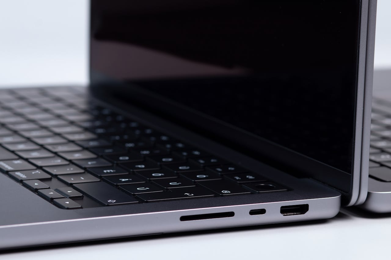 Close-up Shot of a Apple MacBook Pro on a White Surface