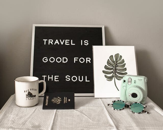 A frame on table written, Travel is good for the soul