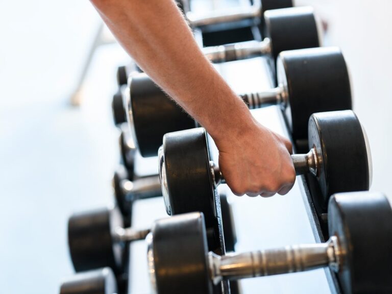 Close-Up Shot of a Person Holding a Dumbbell