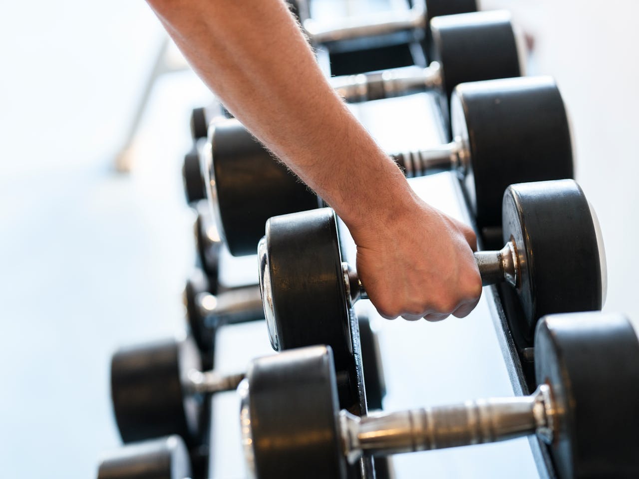 Close-Up Shot of a Person Holding a Dumbbell