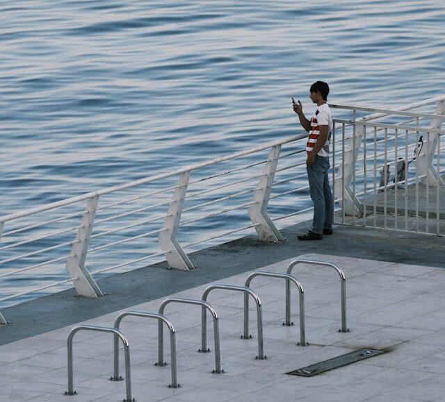 A man standing near shore.