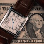 A watch in placed on a currency note.