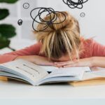 Woman Putting Her Head Down on the Desk