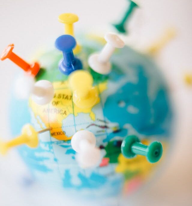 Pins on world map.
