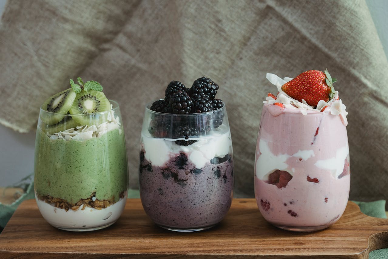 Fresh fruits with yogurt in a clear glass