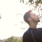 Man in Black Crew Neck Shirt Drinking Water