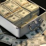 Currency notes of dollars in an open briefcase