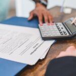 Real Estate Agent Calculating an Amount to a Client