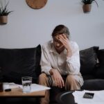 A Woman with Problems Sitting on the Sofa