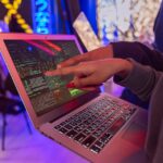 Person Using Macbook Air on Table