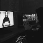 Anonymous person using computer.