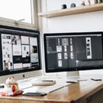 Turned-on Silver Imac on Desk