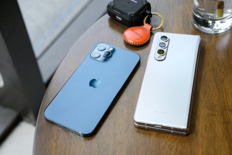 Two smartphones places on a table.