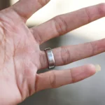 Male hand with silver ring on his fingers
