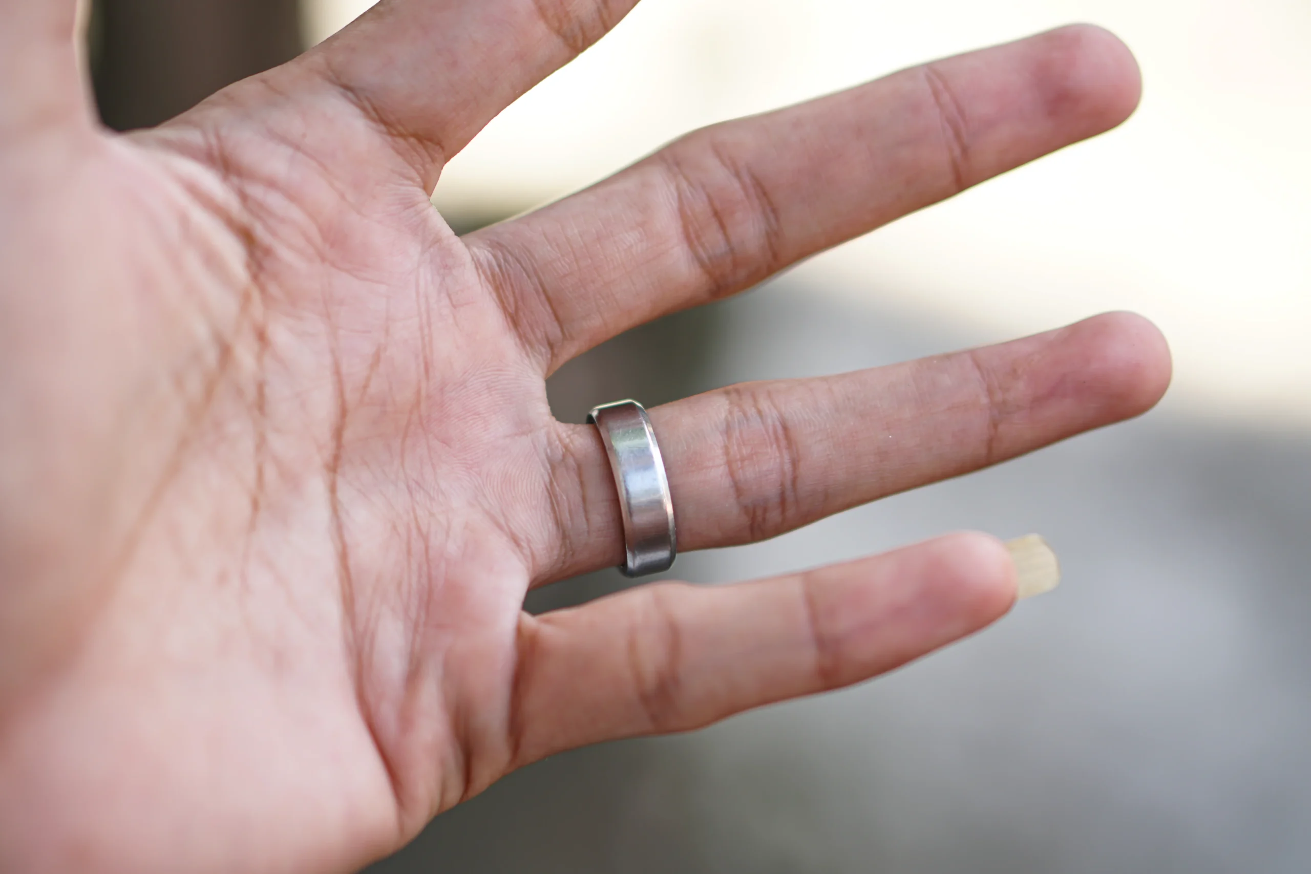 Male hand with silver ring on his fingers
