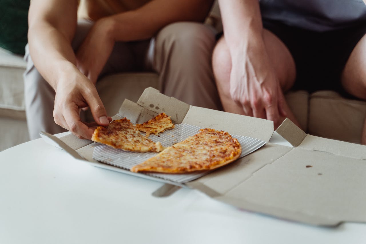 Men Eating Pizza