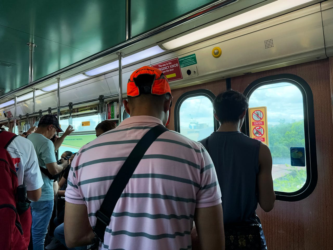 Commuters in Metro Manila MRT Train Interior