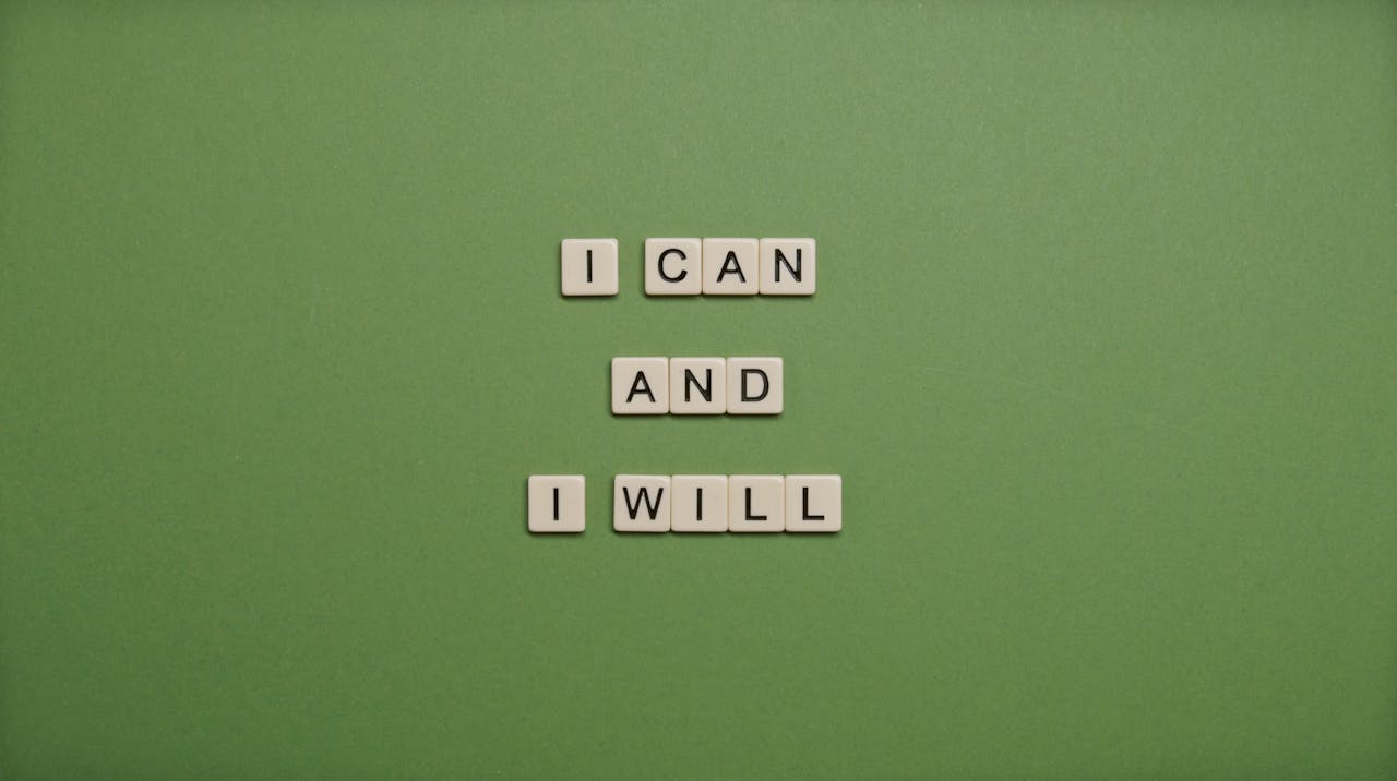I Can and I Will Text On Green Background