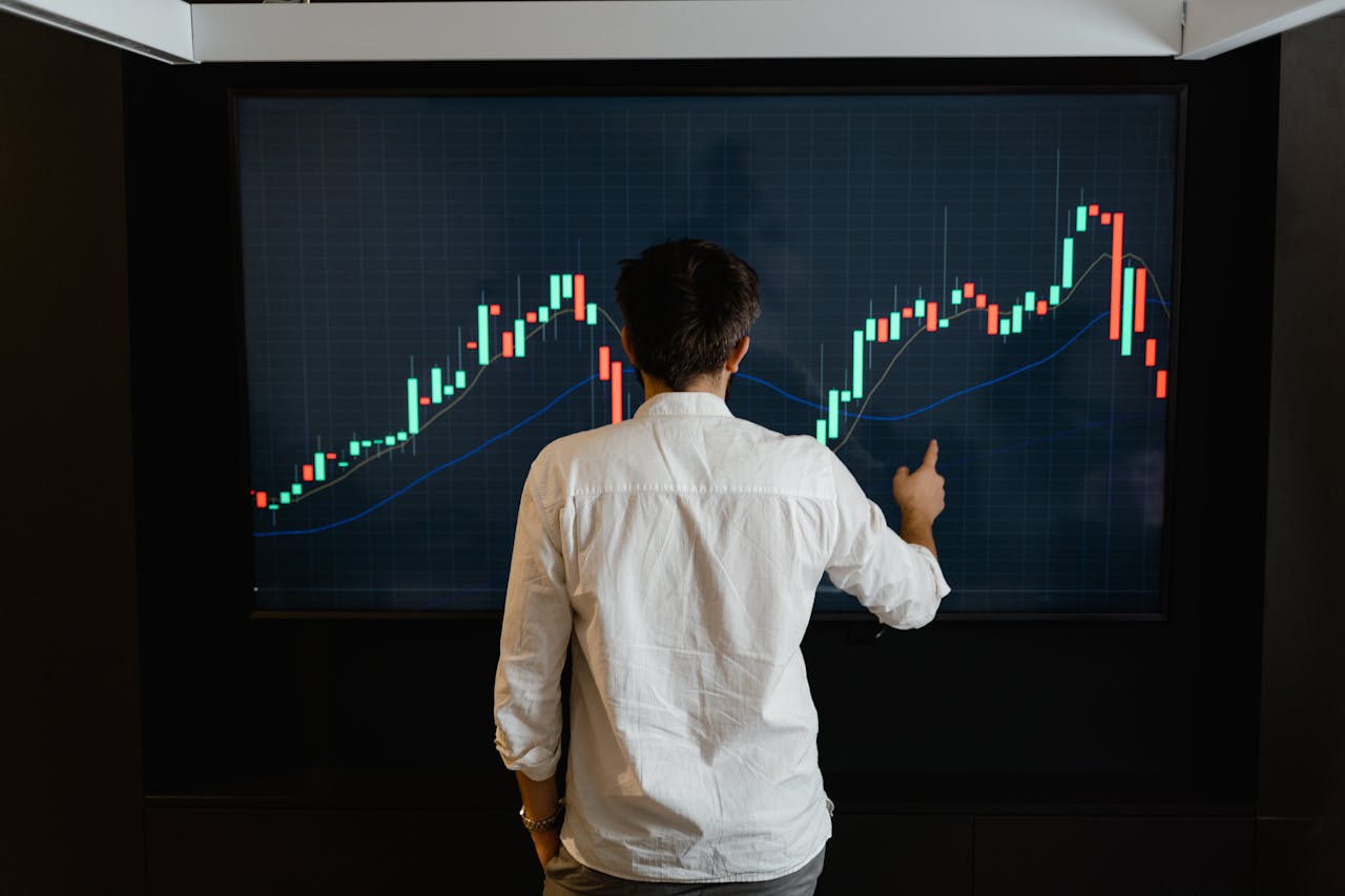 A Man Standing Infront of Blockchain Graph