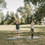 An Elderly Couple Doing Yoga at the Park
